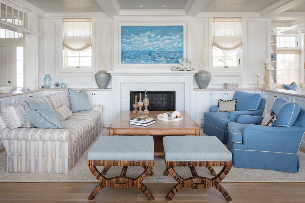 Photo of a mid-sized transitional open concept living room in New York with white walls, light hardwood floors, no fireplace, a tile fireplace surround, a concealed tv and brown floor.