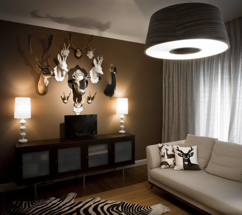 Inspiration for a contemporary family room in DC Metro with brown walls.