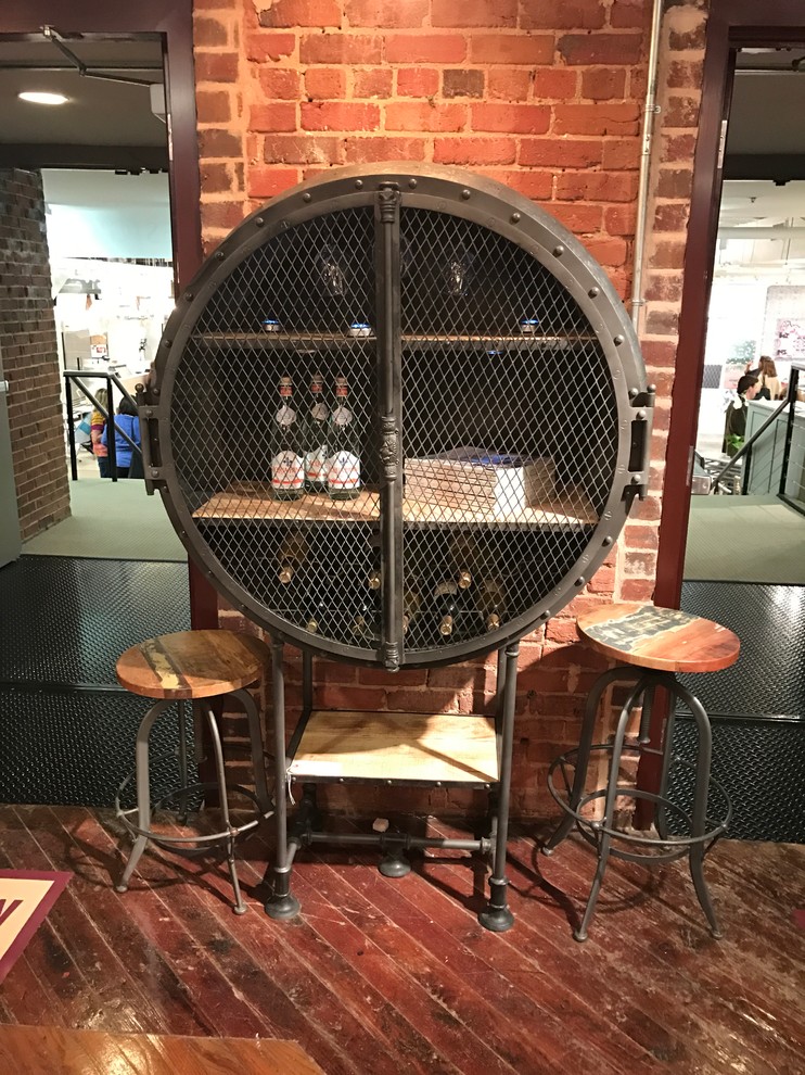 This is an example of an industrial home bar in Atlanta.