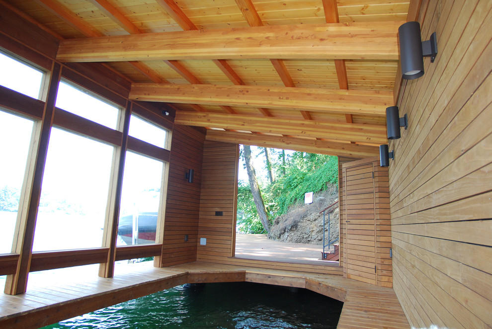 Photo of a small contemporary detached one-car boathouse in Portland.