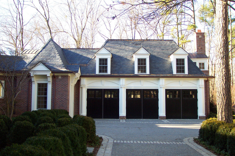 Inspiration for a mid-sized traditional attached three-car garage in Atlanta.