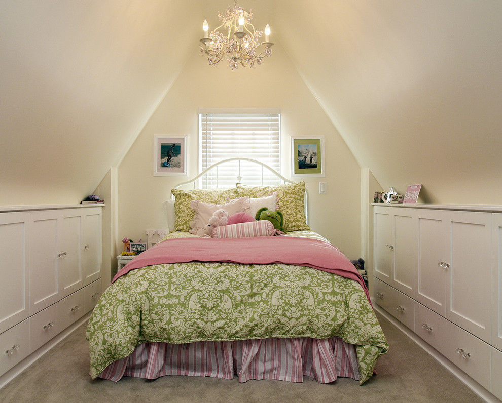 Photo of a traditional kids' bedroom for girls in Salt Lake City with beige walls and carpet.