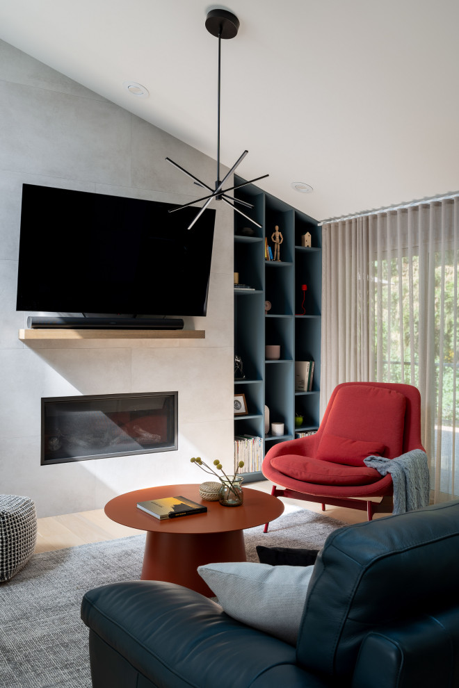 Photo of a contemporary living room in Seattle With Grey Walls, Light Hardwood Flooring, a Ribbon Fireplace and a Wall Mounted TV.
