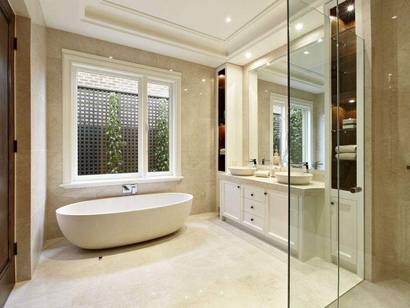 Large mediterranean master bathroom in Melbourne with beaded inset cabinets, beige cabinets, a freestanding tub, a double shower, a one-piece toilet, beige tile, stone tile, beige walls, marble floors, a vessel sink and marble benchtops.