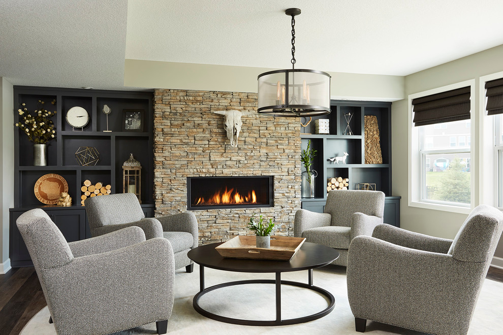 Design ideas for a large transitional walk-out basement in Minneapolis with grey walls, vinyl floors, a ribbon fireplace and a stone fireplace surround.
