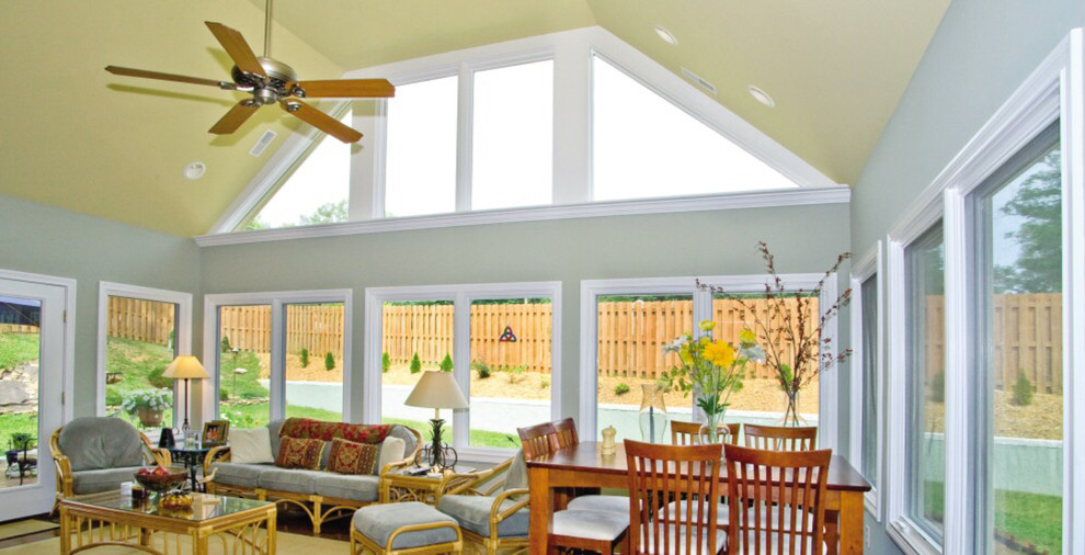 Design ideas for a mid-sized traditional sunroom in Nashville with medium hardwood floors and a standard ceiling.