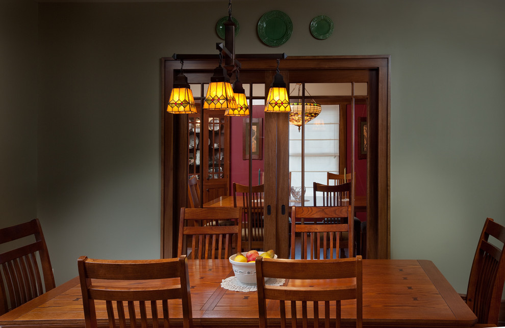 Example of an arts and crafts dining room design in Columbus
