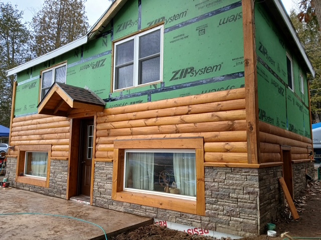 Log Siding, Stamped Concrete and Post and Beam Carport
