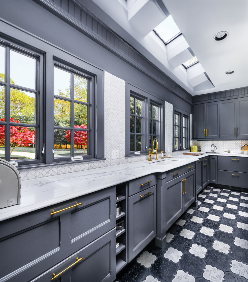 Design ideas for a large transitional l-shaped separate kitchen in New York with quartz benchtops, grey splashback, mosaic tile splashback, shaker cabinets, grey cabinets, black appliances, with island, ceramic floors, multi-coloured floor, a single-bowl sink and white benchtop.