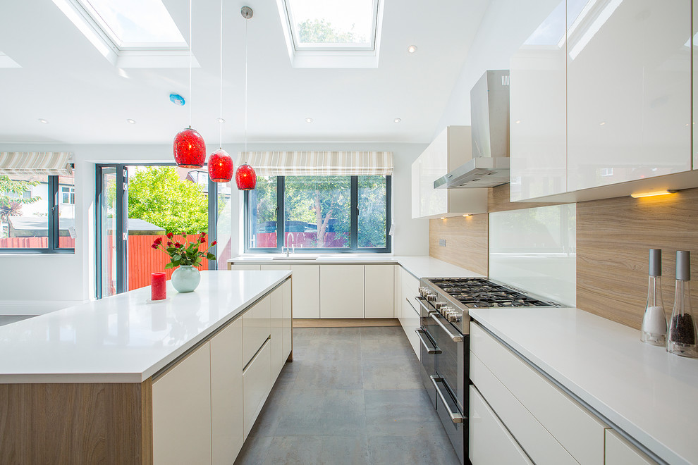 Photo of a contemporary kitchen in London with grey floor.