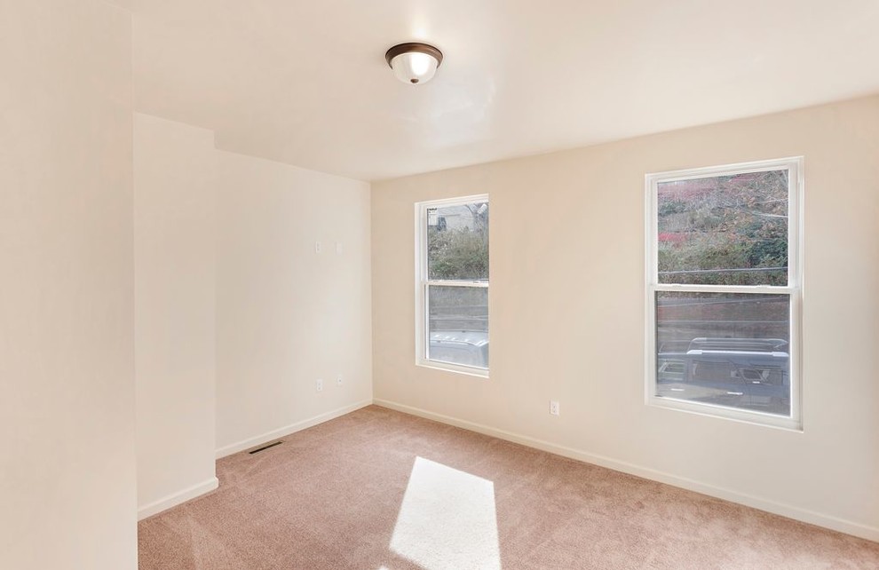 Example of a small transitional master carpeted and beige floor home design design with white walls