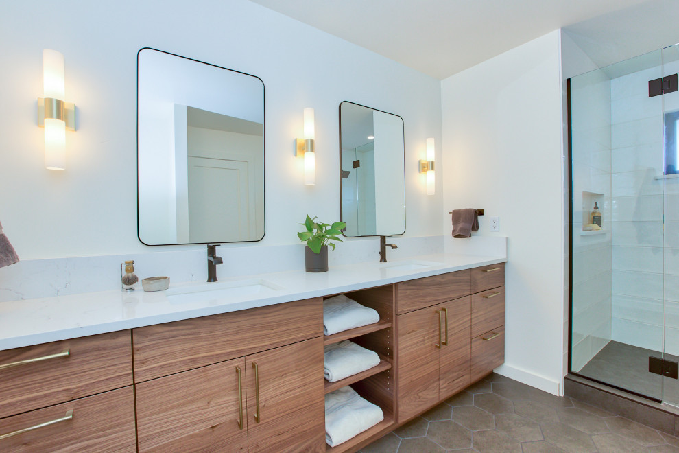 Inspiration for a small midcentury master bathroom in Seattle with flat-panel cabinets, medium wood cabinets, an alcove tub, an alcove shower, a two-piece toilet, white tile, porcelain tile, white walls, porcelain floors, an undermount sink, engineered quartz benchtops, grey floor, a shower curtain, white benchtops, a niche, a double vanity and a built-in vanity.