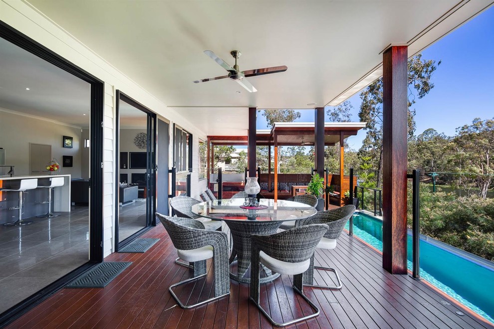 Inspiration for a contemporary patio in Brisbane with a roof extension.