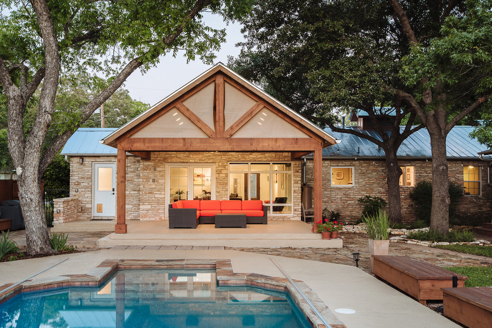 Photo of a large modern backyard verandah in Austin with concrete slab.