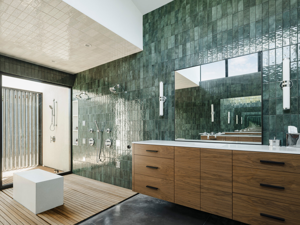 Photo of a modern master bathroom in Phoenix with flat-panel cabinets, medium wood cabinets, a freestanding tub, an open shower, green tile, ceramic tile, an undermount sink, engineered quartz benchtops, white benchtops, a shower seat, a double vanity and a floating vanity.