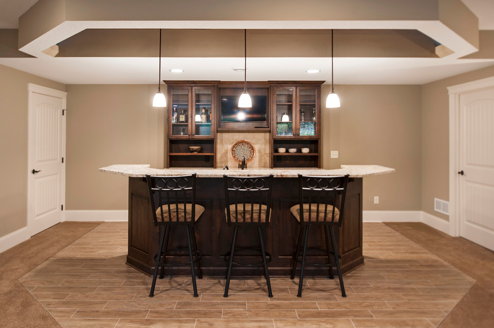 Design ideas for a mid-sized arts and crafts u-shaped wet bar in Minneapolis with an undermount sink, raised-panel cabinets, dark wood cabinets, granite benchtops, brown splashback, travertine splashback and ceramic floors.