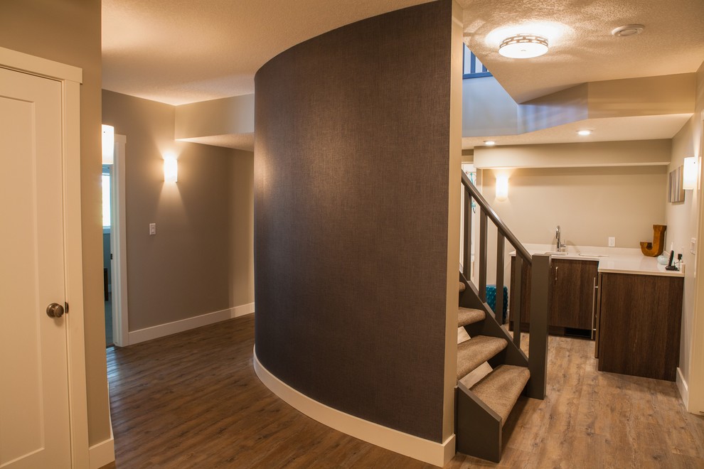 Inspiration for a mid-sized transitional carpeted curved staircase remodel in Calgary