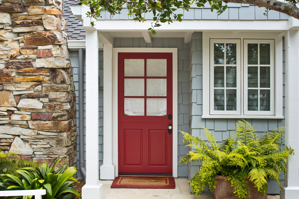 Example of a mid-sized transitional blue exterior home design in Other
