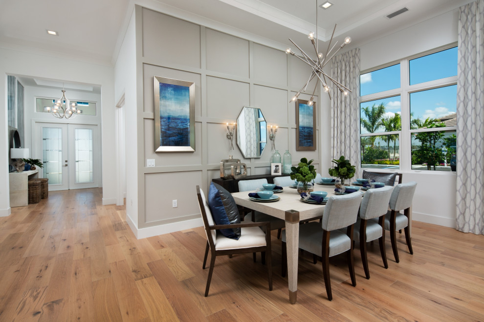 Mid-sized beach style open plan dining in Other with grey walls, medium hardwood floors and coffered.