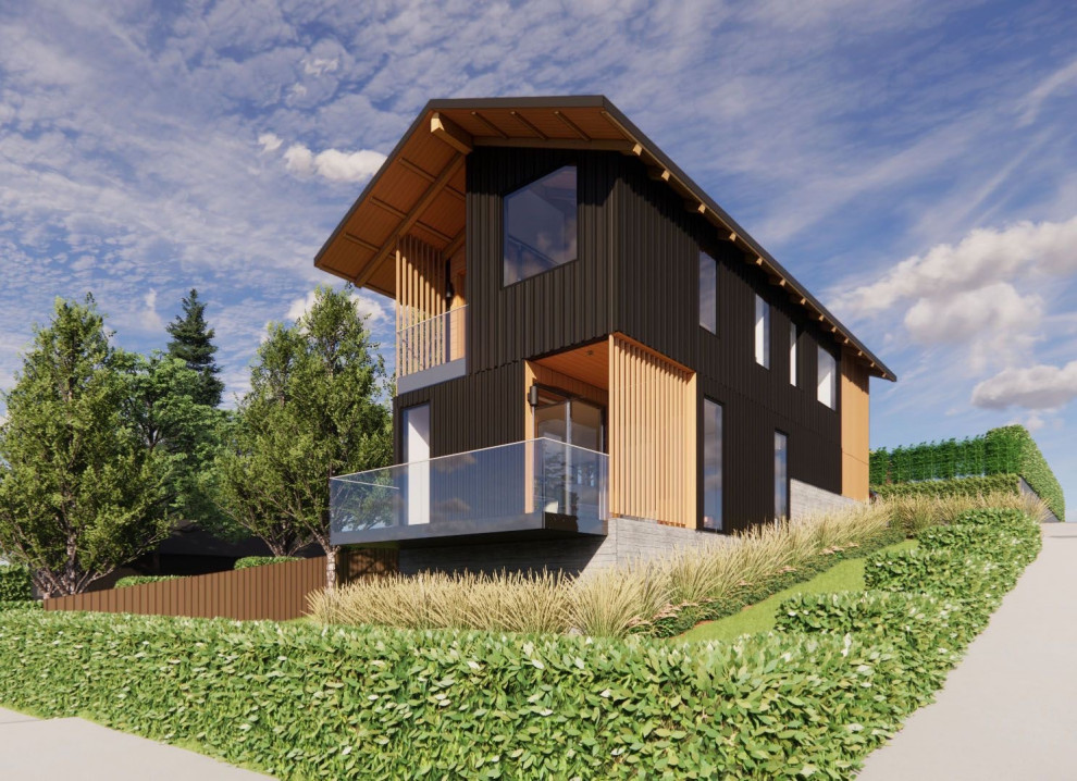 Mittelgroßes Skandinavisches Haus mit schwarzer Fassadenfarbe, Satteldach, Blechdach, schwarzem Dach und Wandpaneelen in Portland