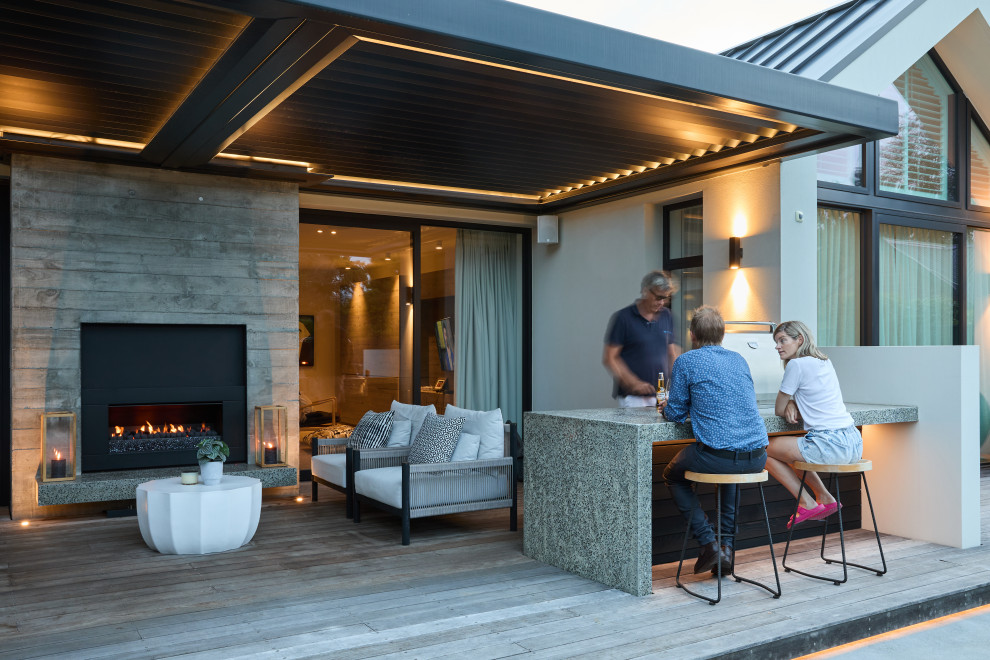 Design ideas for a contemporary Courtyard deck in Christchurch With a Pergola.
