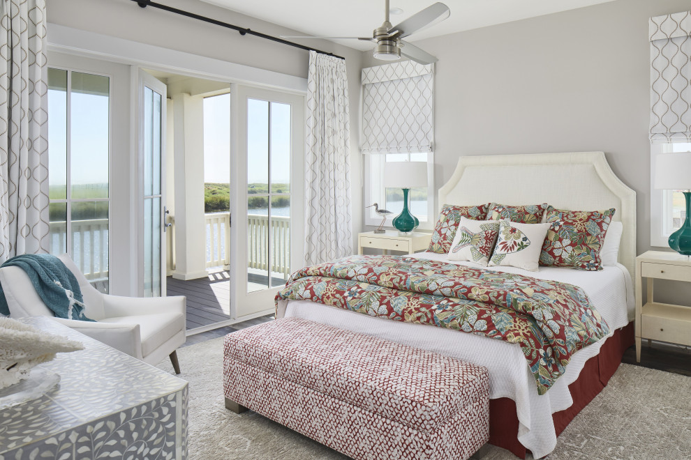 Photo of a mid-sized beach style master bedroom in Other with grey walls, vinyl floors and brown floor.