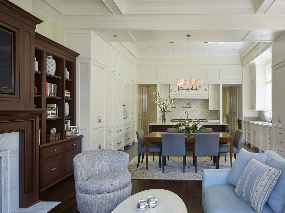 Huge elegant u-shaped limestone floor open concept kitchen photo in Chicago with a double-bowl sink, recessed-panel cabinets, white cabinets, quartzite countertops, beige backsplash, mosaic tile backsplash, paneled appliances and an island