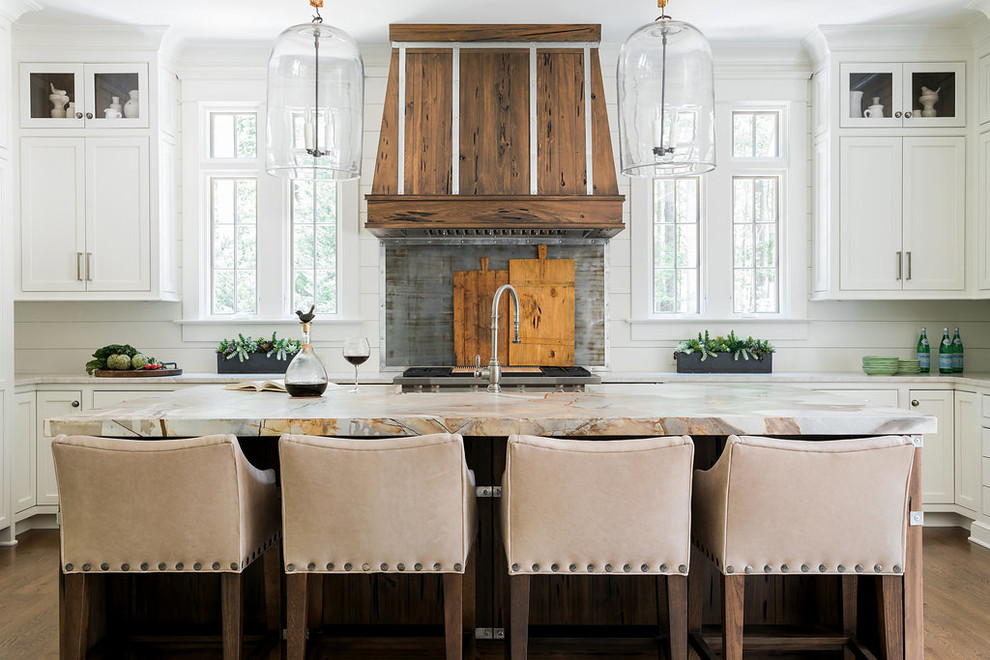 Inspiration for a mid-sized country u-shaped dark wood floor and brown floor eat-in kitchen remodel in Atlanta with shaker cabinets, white cabinets, white backsplash, stainless steel appliances, an island, gray countertops, granite countertops and wood backsplash