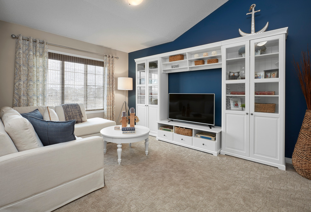 Inspiration for a large transitional loft-style family room in Edmonton with blue walls, carpet and a freestanding tv.