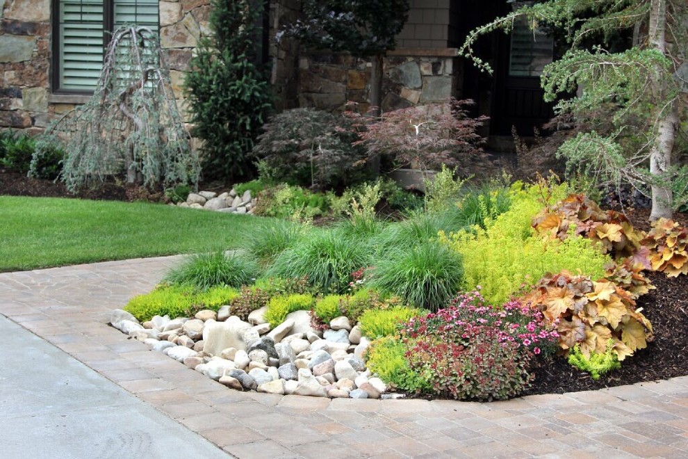 Photo of a traditional garden in Salt Lake City with with flowerbed and brick pavers.