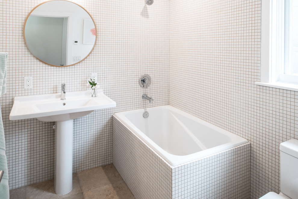 Mid-sized modern master bathroom in Other with a drop-in tub, a shower/bathtub combo, a two-piece toilet, white tile, ceramic tile, white walls, limestone floors, a pedestal sink, brown floor and an open shower.