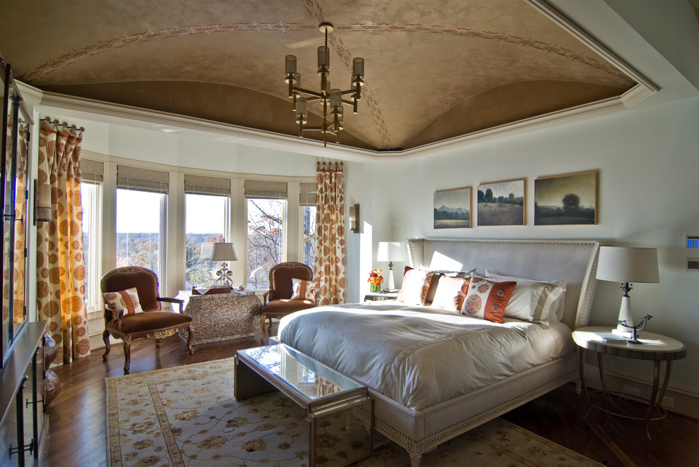 Design ideas for an eclectic bedroom in Charlotte with white walls and medium hardwood floors.
