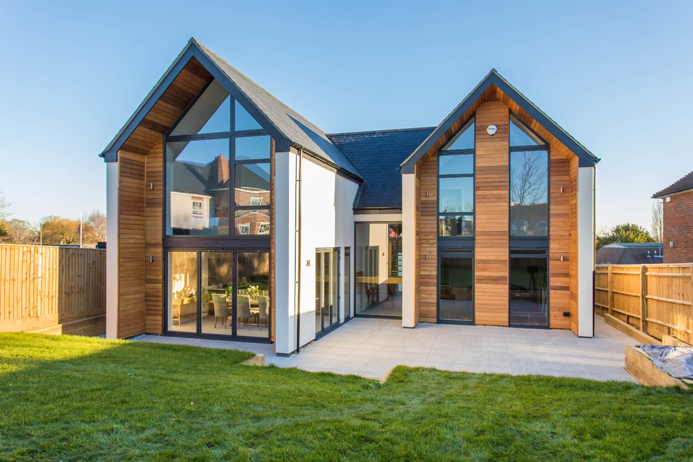 Large contemporary two-storey house exterior in Buckinghamshire with wood siding and a gable roof.