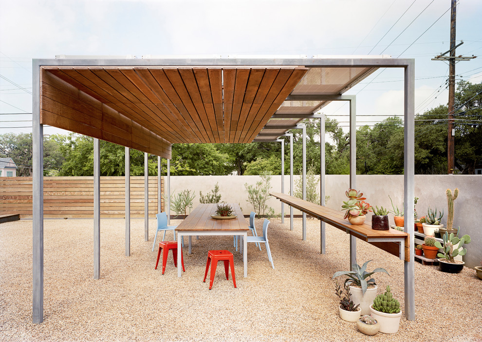 Design ideas for a modern landscaping in Austin with a pergola.