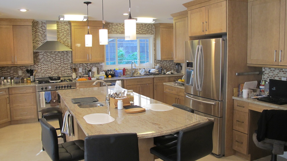 Mid-sized transitional u-shaped concrete floor and beige floor open concept kitchen photo in New York with an undermount sink, an island, recessed-panel cabinets, light wood cabinets, granite countertops, multicolored backsplash, mosaic tile backsplash, stainless steel appliances and beige countertops