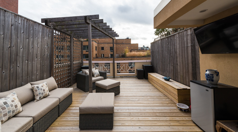 Large contemporary rooftop and rooftop deck in New York with a pergola.