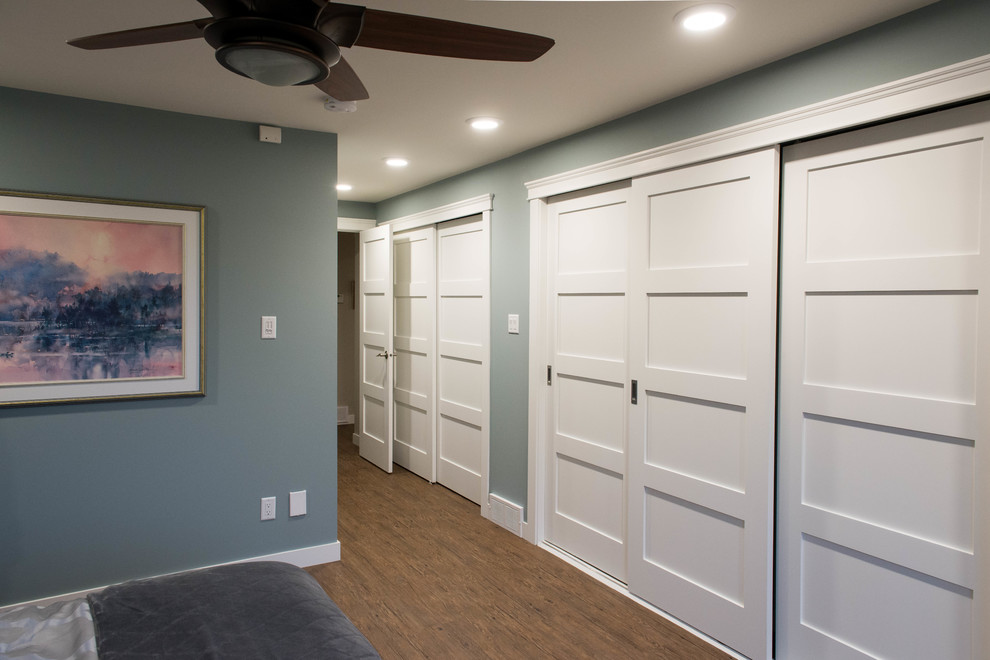 Mid-sized transitional gender-neutral vinyl floor reach-in closet photo with shaker cabinets and white cabinets