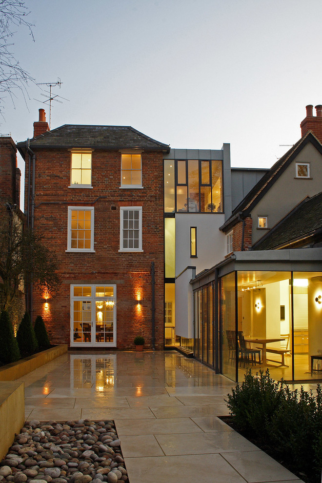 Contemporary brick exterior in Berkshire with a hip roof.