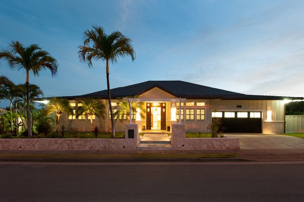 Example of a large transitional beige one-story exterior home design in Hawaii