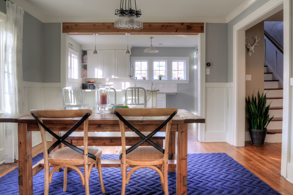 Photo of a mid-sized country open plan dining in Detroit with grey walls and dark hardwood floors.
