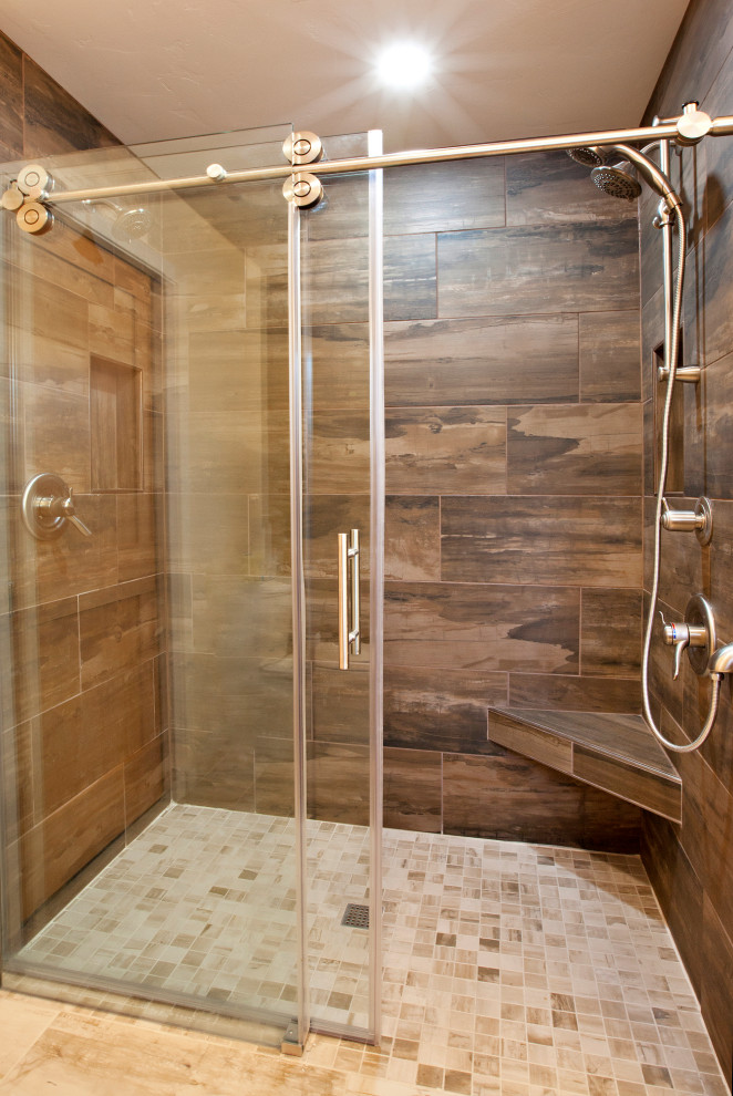 Alcove shower - mid-sized transitional 3/4 beige tile and porcelain tile porcelain tile, beige floor and double-sink alcove shower idea with shaker cabinets, medium tone wood cabinets, a two-piece toilet, yellow walls, an undermount sink, quartz countertops, brown countertops, a niche and a built-in vanity
