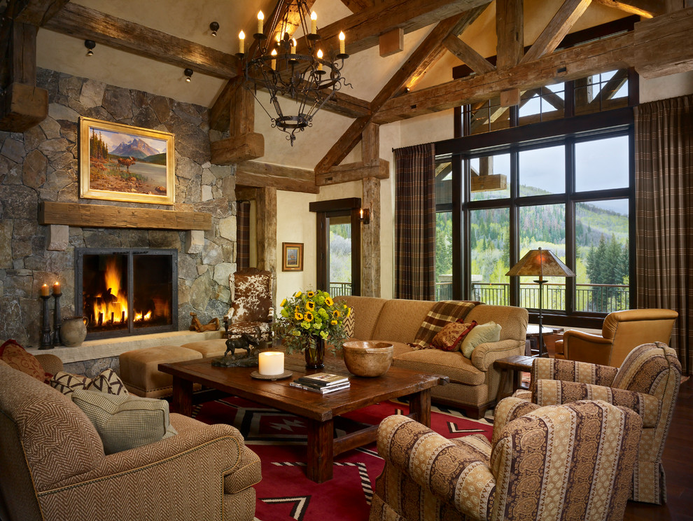 Country open concept living room in Denver with beige walls, a standard fireplace and a stone fireplace surround.