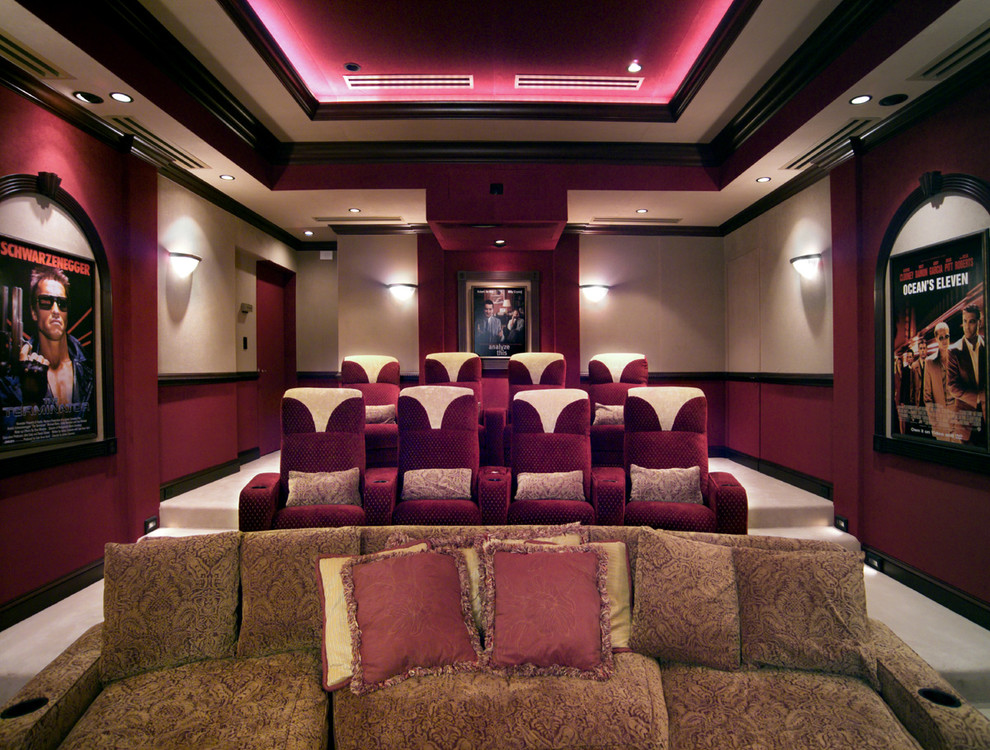 This is an example of a mid-sized traditional enclosed home theatre in Philadelphia with beige walls, carpet and a built-in media wall.