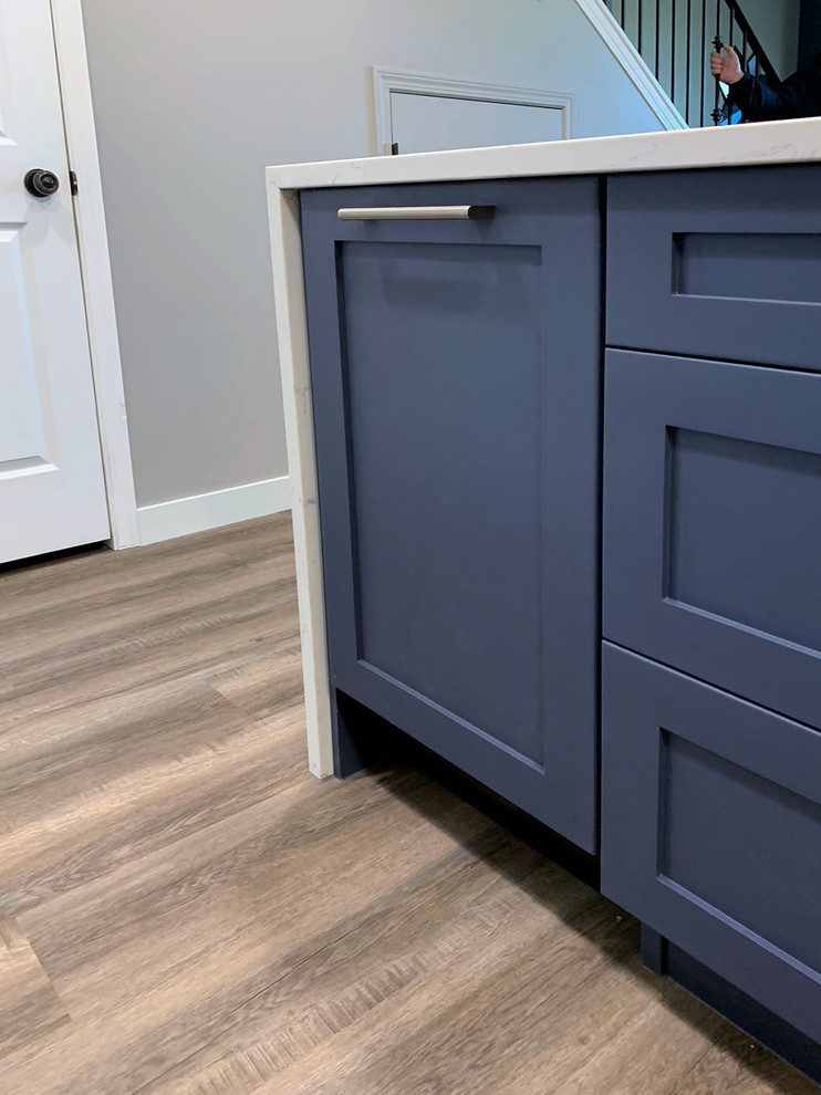 Example of a transitional kitchen design in Calgary