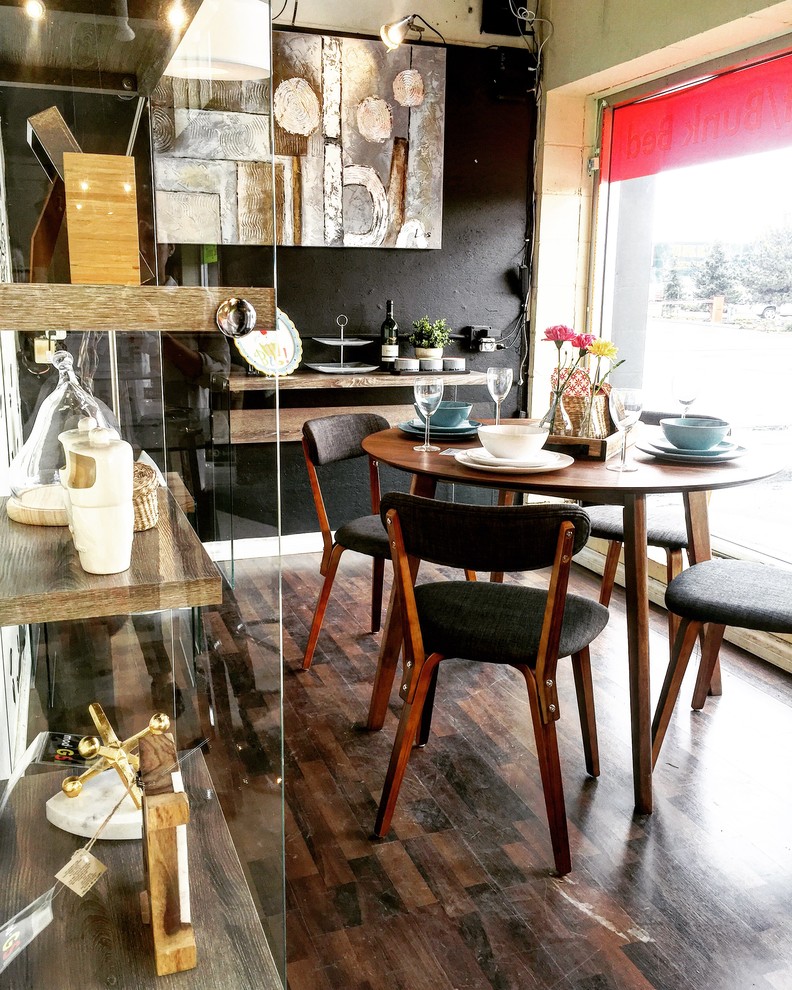 Great room - small mid-century modern laminate floor great room idea in Vancouver with black walls