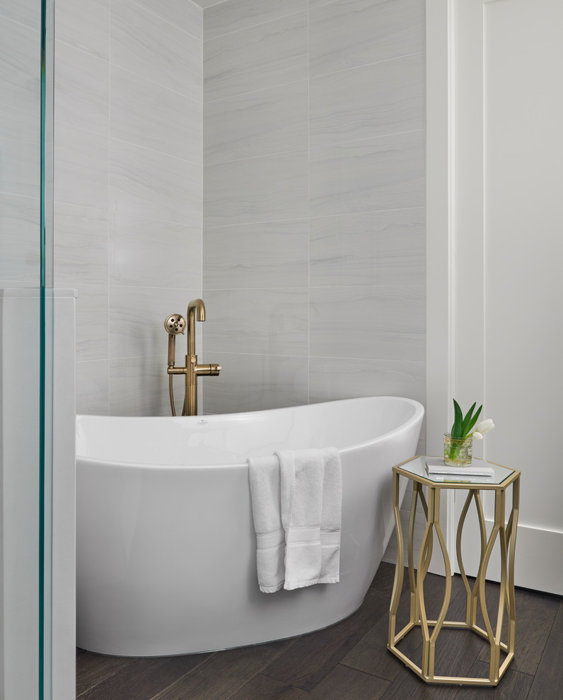 Design ideas for a mid-sized transitional master bathroom in Other with flat-panel cabinets, white cabinets, a freestanding tub, a corner shower, a bidet, white tile, marble, dark hardwood floors, an undermount sink, quartzite benchtops, brown floor, a hinged shower door and white benchtops.