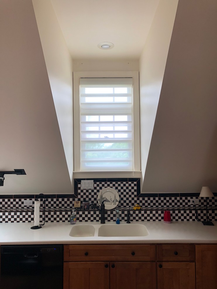 Transitional kitchen in Philadelphia with black splashback, ceramic splashback and beige benchtop.