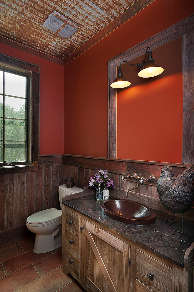 Small country 3/4 bathroom in Detroit with a vessel sink, flat-panel cabinets, light wood cabinets, granite benchtops, a two-piece toilet, orange walls, ceramic floors, brown tile and stone tile.
