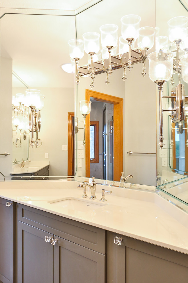 Large transitional master bathroom in Austin with shaker cabinets, grey cabinets, a claw-foot tub, an alcove shower, a one-piece toilet, gray tile, marble, an undermount sink, solid surface benchtops, a sliding shower screen and yellow benchtops.