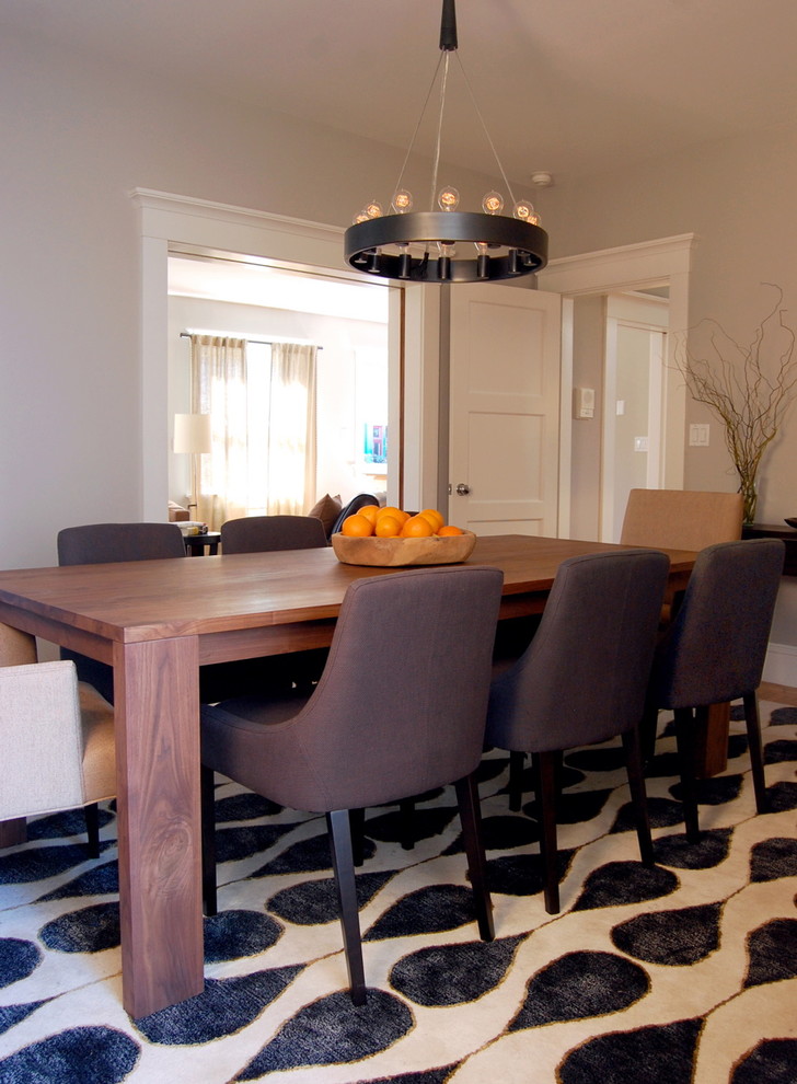 Inspiration for a transitional separate dining room in San Francisco with grey walls.